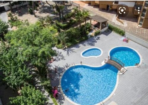 an overhead view of two swimming pools at Beautiful apartment in Salou with pool access in Salou