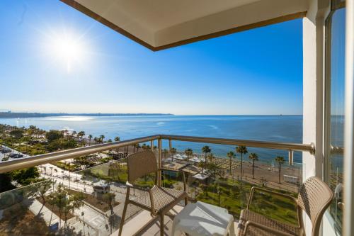 a balcony with chairs and a view of the ocean at PEARLY HOTEL in Antalya