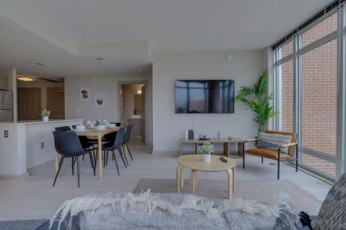a living room with a couch and a table at Wonderful 2BR Apartment at Crystal City in Arlington