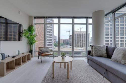 a living room with a couch and a table at Wonderful 2BR Apartment at Crystal City in Arlington