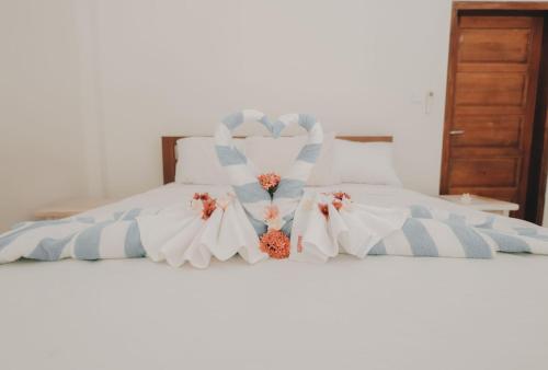 Ένα ή περισσότερα κρεβάτια σε δωμάτιο στο Anugerah Villas 2
