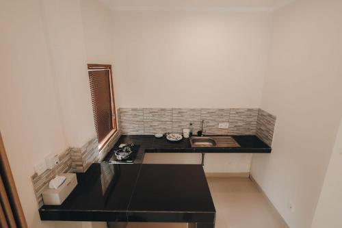 Η κουζίνα ή μικρή κουζίνα στο Anugerah Villas 2