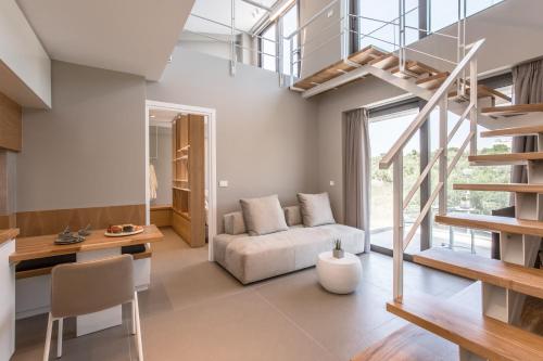 a living room with a couch and a table at Noemie Luxury Suites in Chania Town