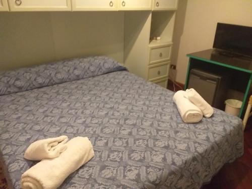 Letto o letti in una camera di B&B Nuovo Paradiso