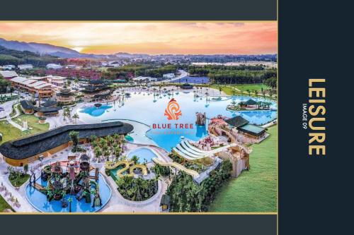 an aerial view of a water park at blue tree at 3 BR Stylish Condo with Private Rooftop Pool in Kamala Beach