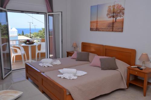 Ένα ή περισσότερα κρεβάτια σε δωμάτιο στο Sunny Rooms