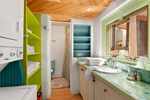 a bathroom with a sink and a mirror at 632 Old Santa Fe Trail in Santa Fe