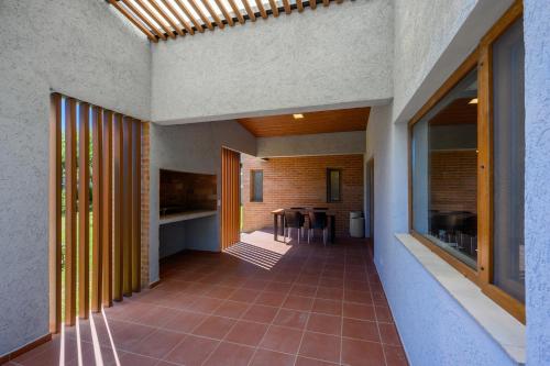 an internal corridor of a house with a hallway with a table at Casas Acrux in Nono