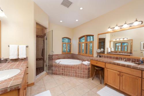a large bathroom with two sinks and a tub at 246 Beaver Circle in Durango Mountain Resort