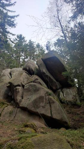 a rock with a tent sitting on top of it at Chopina 6 na zielonym wzgórzu in Jedlina-Zdrój