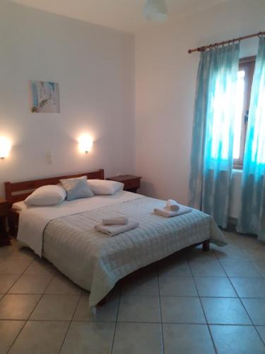 Postel nebo postele na pokoji v ubytování Cerigo House