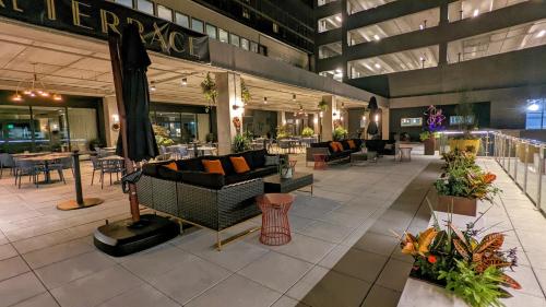 a lobby of a building with couches and tables at Holiday Inn Lancaster by IHG in Lancaster