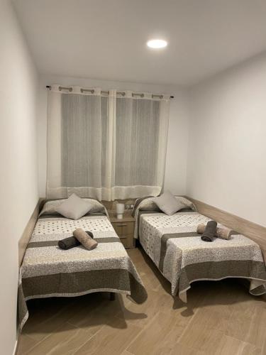 Postel nebo postele na pokoji v ubytování Moraira Calamora