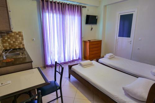 Katil atau katil-katil dalam bilik di Hotel Chris