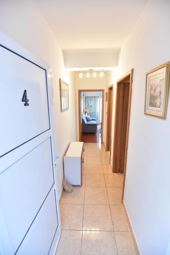 a hallway with a living room and a couch at Holiday Home in Komarna