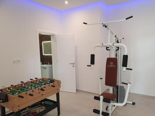 a room with a exercise machine in a room at Luxury Villa Sun Stone heated pool & whirlpool in Trogir