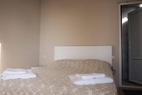 Postel nebo postele na pokoji v ubytování nira hotel