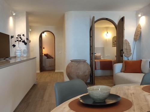 a living room with a couch and a table with a bowl on it at Malaga stylish beach apartments in Málaga
