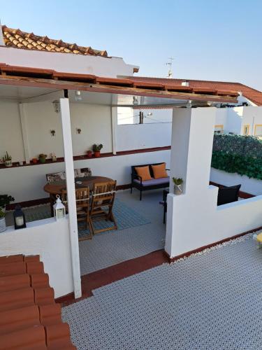 a view of a patio with a table and chairs at Beja Garden in Beja