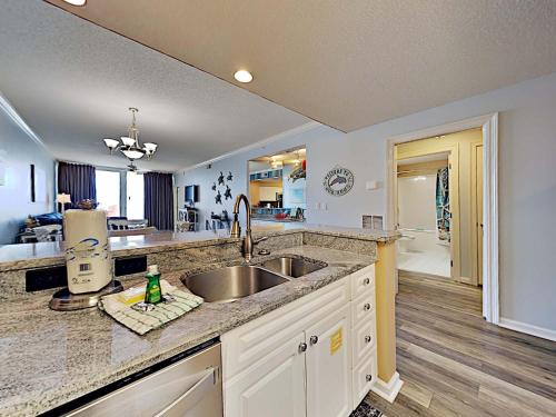 a kitchen with a sink and a counter top at The Pearl of Navarre #1403 in Navarre