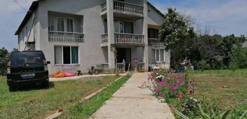 a van parked in front of a building at Special Guest House in Guria in Chala