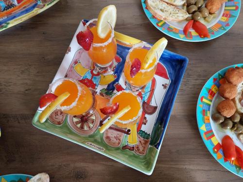a plastic tray with fruit cocktails on a table at B&B Alfrantoio Valderice in Valderice