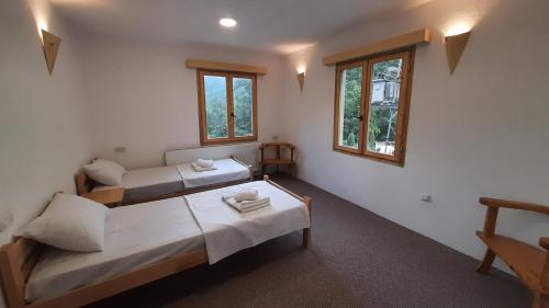 Postel nebo postele na pokoji v ubytování Hotel Ravnjak