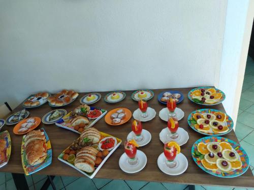 a table with many plates of food on it at B&B Alfrantoio Valderice in Valderice