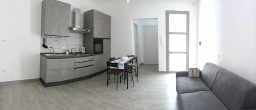 Kuchyň nebo kuchyňský kout v ubytování Antico Cortile