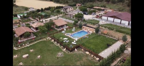 an aerial view of a house with a swimming pool at El BURGO DE OSMA ALOJAMIENTO RURAL VILLA BAGH in El Burgo de Osma