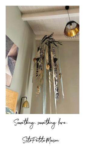 a chandelier hanging from a ceiling in a room at Sistò Petite Maison in Altamura