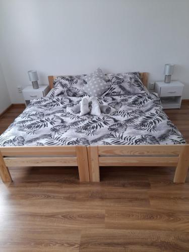 A bed or beds in a room at Apartmany Diana