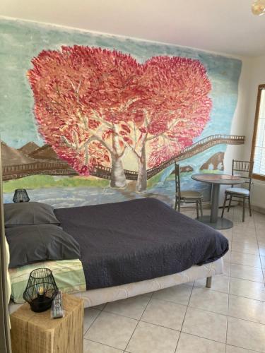 a bedroom with a large heart mural on the wall at Chez Nenette in Esclavolles-Lurey