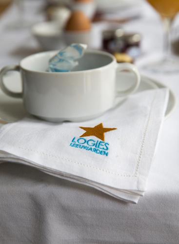 a cup sitting on top of a napkin next to a cup at Sterlogies City Penthouse in Leeuwarden