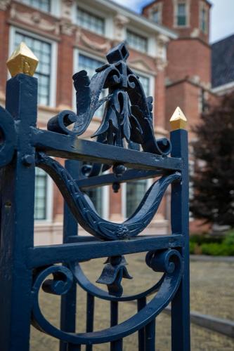 a blue iron gate with a horse on it at Sterlogies City Penthouse in Leeuwarden