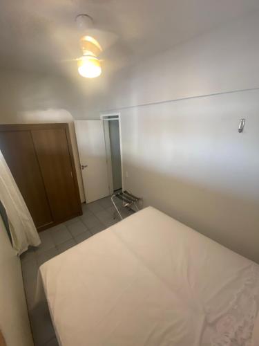 Cama o camas de una habitación en Fortaleza com conforto e praticidade