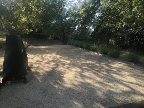 a black object sitting in the middle of a dirt road at Studio au calme vue sur garlaban in Roquevaire