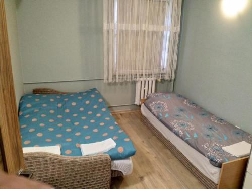 Posteľ alebo postele v izbe v ubytovaní Apartament Blisko Plaży