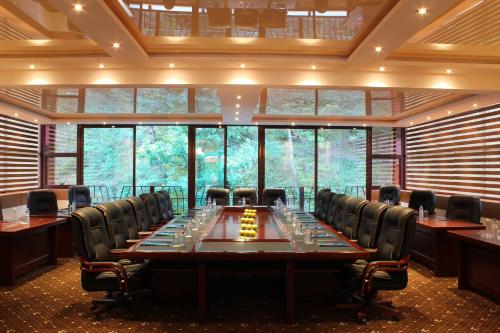 a large conference room with a long table and chairs at Best Western Plus Paradise Hotel Dilijan in Dilijan