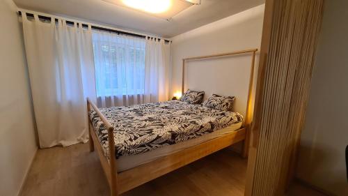 a bedroom with a bed and a window at Your Space in Jurmala in Jūrmala