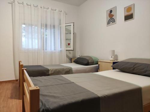 Katil atau katil-katil dalam bilik di Apartment Čengo
