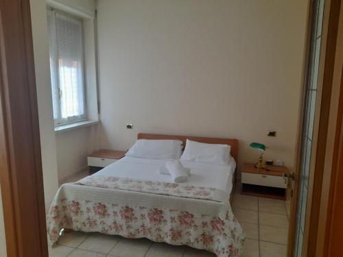 a bedroom with a bed and a window at Giulietta Apartments City Centre Verona in Verona