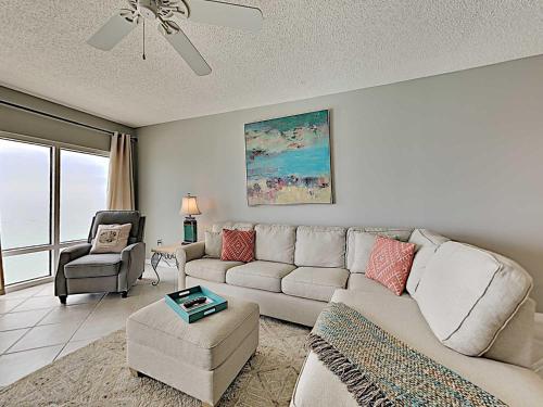 a living room with a couch and a chair at Emerald Isle #1606 in Pensacola Beach