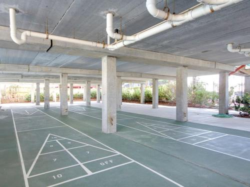 an empty parking lot with a tennis court at Santa Rosa Dunes #952 in Pensacola Beach