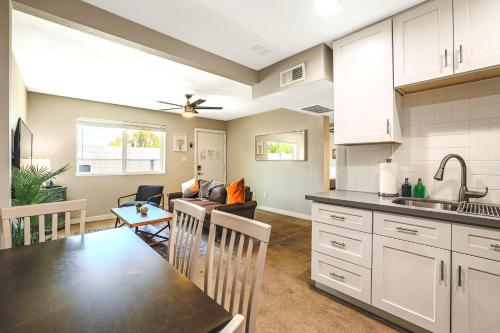 a kitchen and living room with a table and a dining room at LaRocco On Turney Biltmore in Phoenix