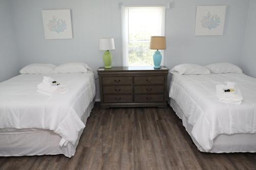 A bed or beds in a room at Ocean Front with Spectacular Views!