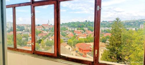 a view of a city from a window at Apartment Niceview in Târgu-Mureş