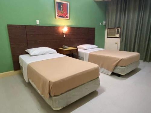 Postel nebo postele na pokoji v ubytování BEST FORTUNE HOTEL at CHINATOWN