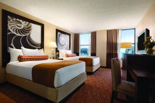 a hotel room with two beds and a television at Bally's Atlantic City Hotel & Casino in Atlantic City