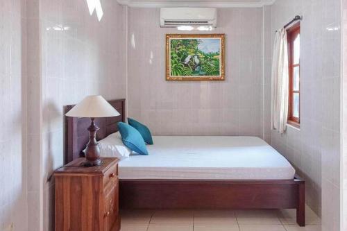 Postel nebo postele na pokoji v ubytování Banana Home Stay Ubud